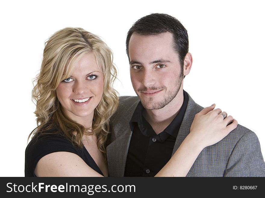 Couple with arms around each other smiling at the camera, isolated on white background. Couple with arms around each other smiling at the camera, isolated on white background.