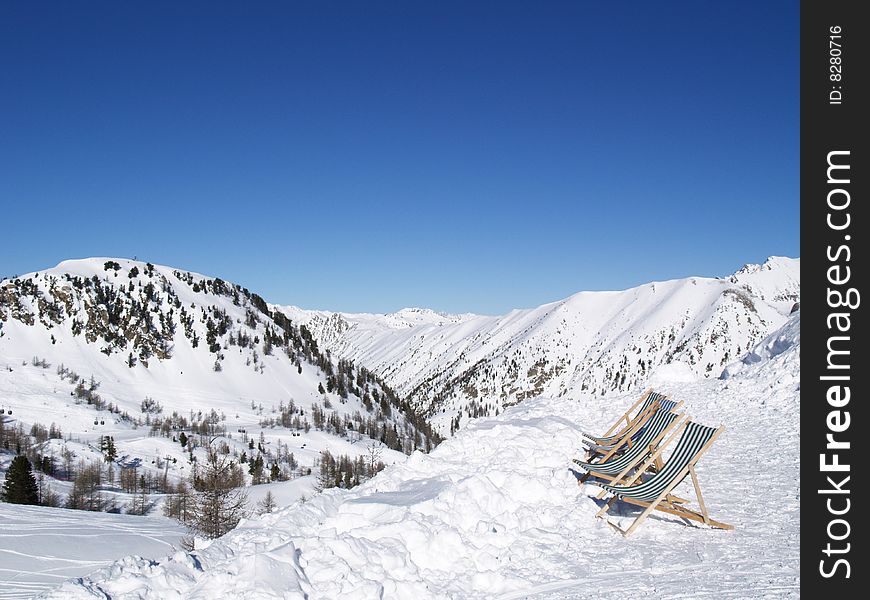 White mountains with blue sky and deckchairs. White mountains with blue sky and deckchairs