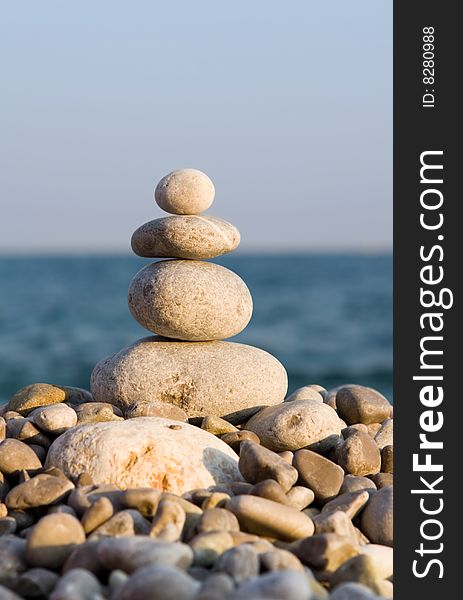 Balanced stones on the sea
