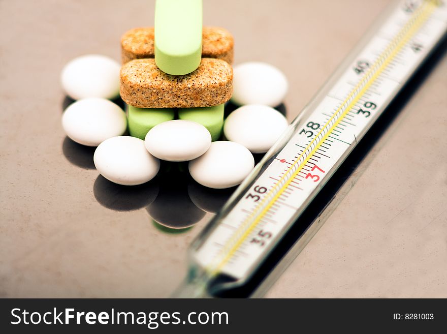 A Thermometer And Pills