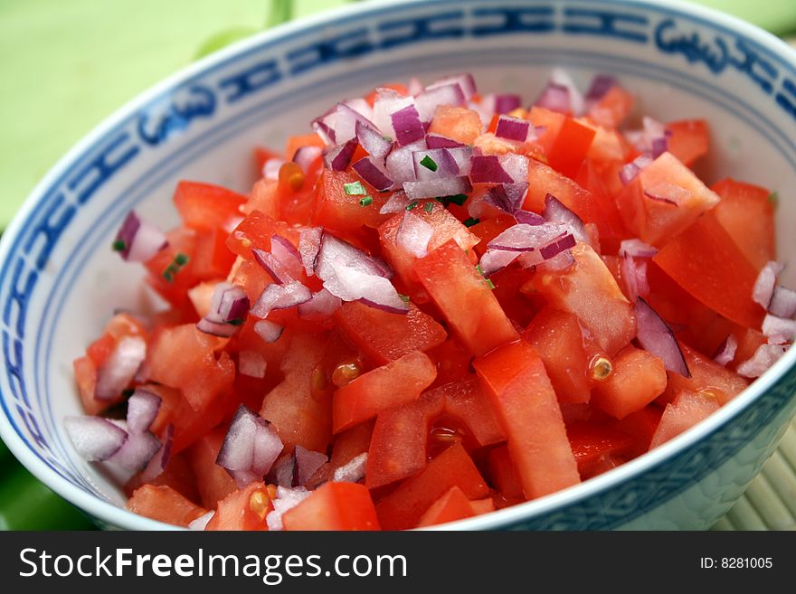 A fresh salad of tomatoes and red onions