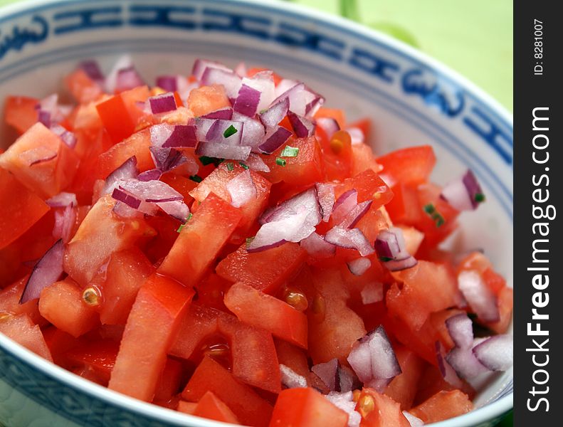 A fresh salad of tomatoes and red onions