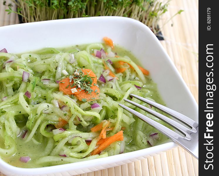 A fresh salad of cucumbers and carrots