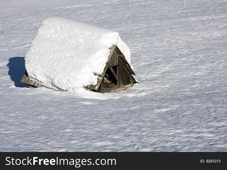 Hut in mountains covered with snow. Hut in mountains covered with snow.