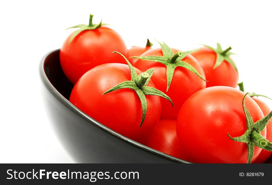 Tomatoes in a black bowl. Tomatoes in a black bowl