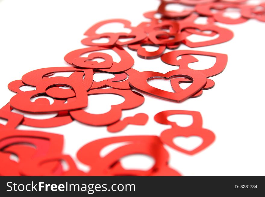 Heart shaped confetti on white background. Heart shaped confetti on white background