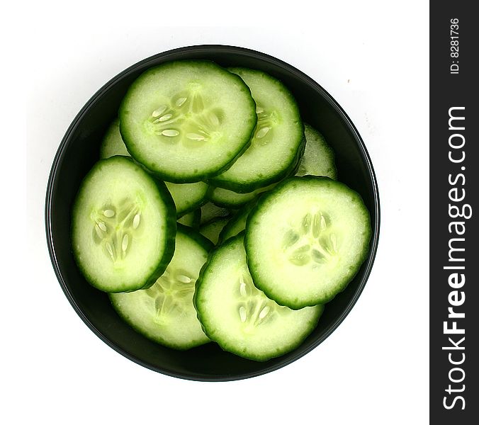 Cucumber slices in a black bowl