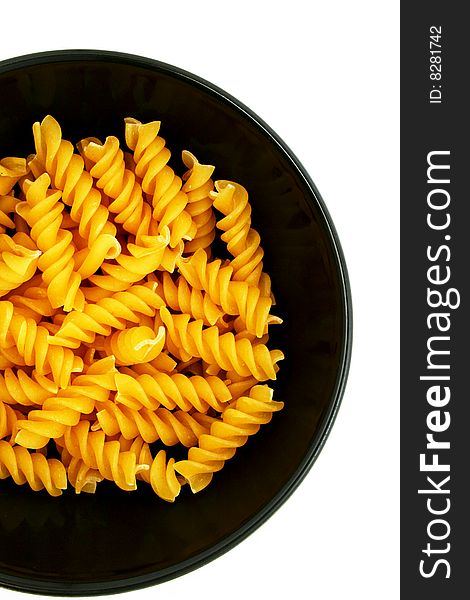 Pasta in a black bowl on white background. Pasta in a black bowl on white background