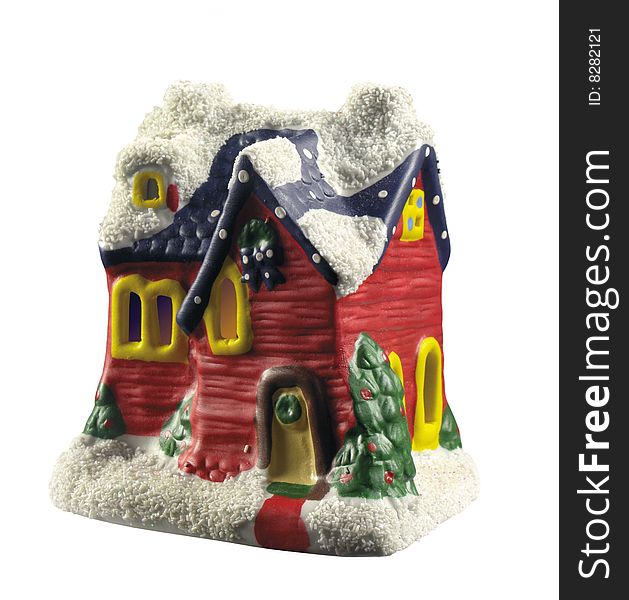 a little toy house with snow on the roof. a little toy house with snow on the roof