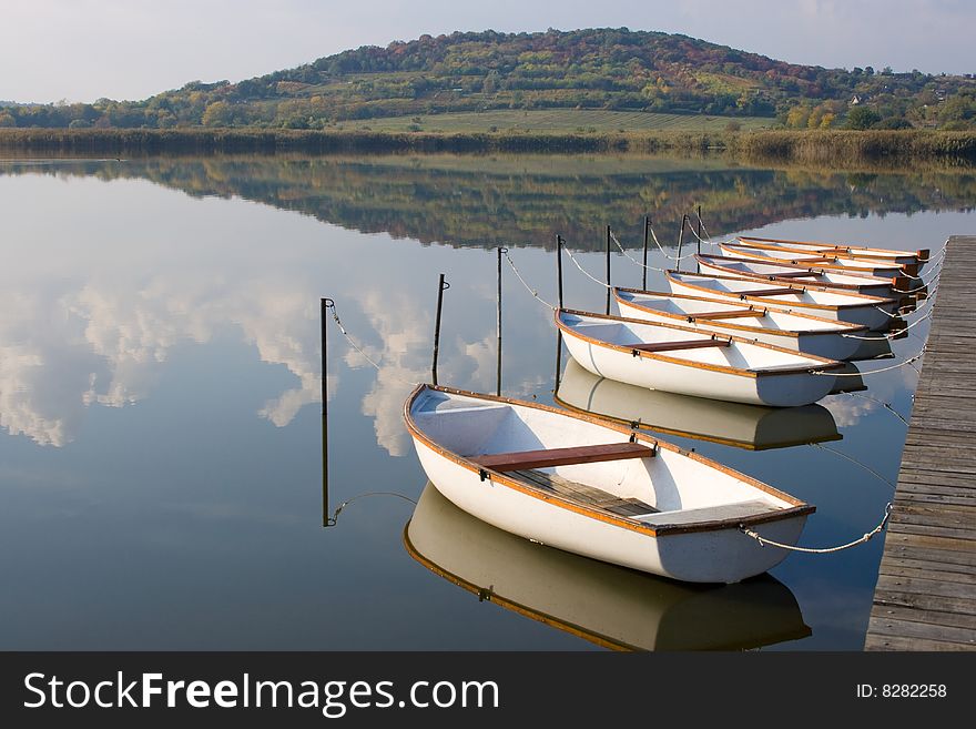 White boats at a boat harbor. White boats at a boat harbor.