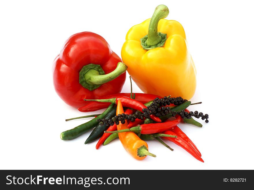 Paprika and different kinds of pepper on white background. Paprika and different kinds of pepper on white background.