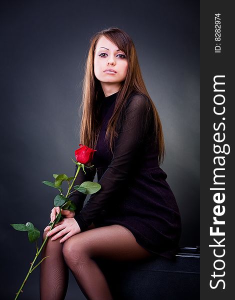 Sensual girl with rose, studio shot