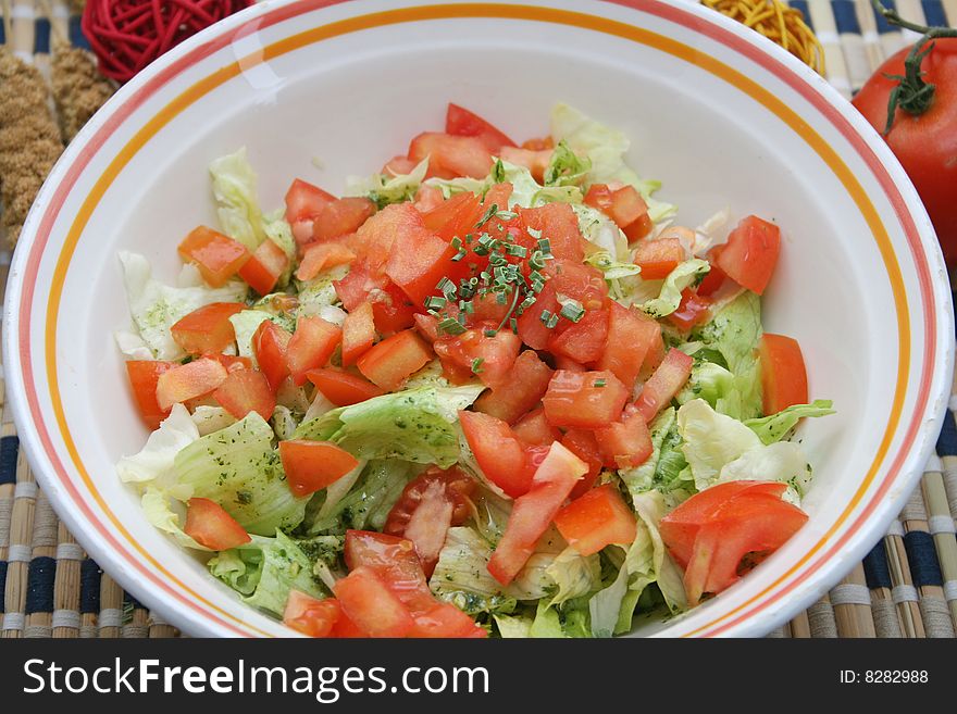 A meal of fresh salad with tomatoes and spices