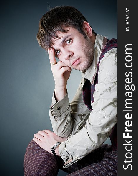 Thoughtful stylish man, studio shot