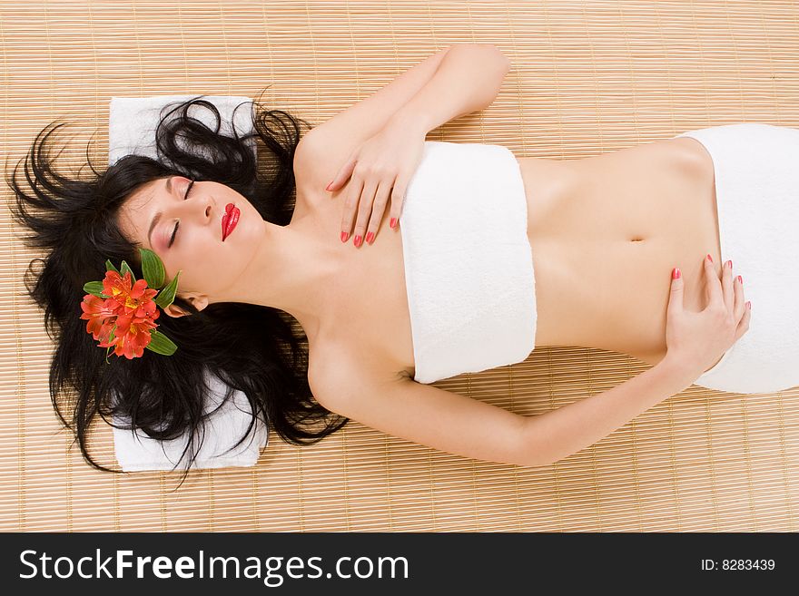 Spa brunette with flowers