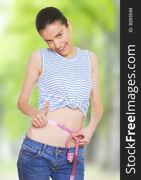 Woman measuring her small waist. Woman measuring her small waist