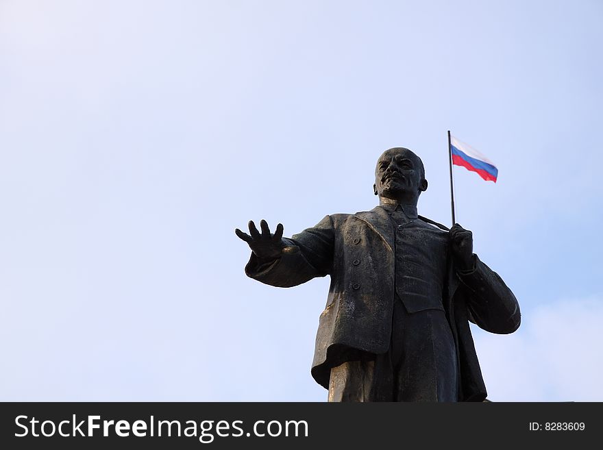 Monument of Lenin with flag of Russia Federation