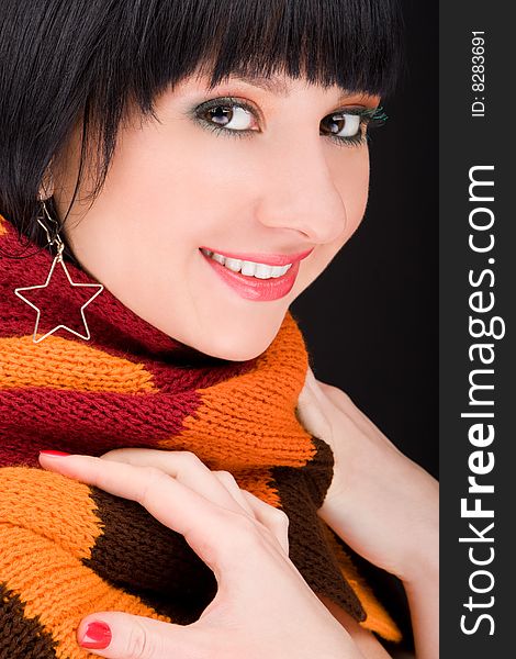 Portrait of the woman with scarf on black background