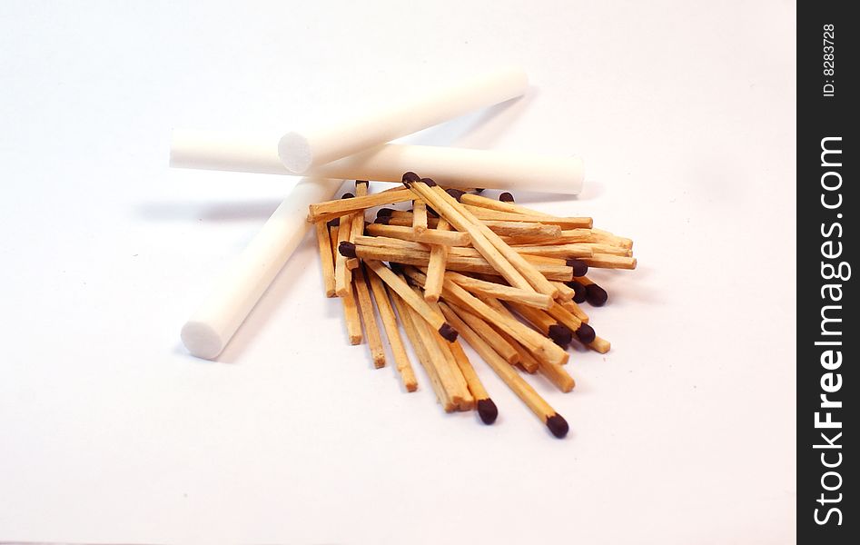 Small heap of wooden sticks - matches and cigaretttes