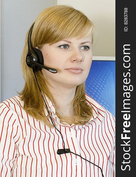 Beautiful girl with head set in office