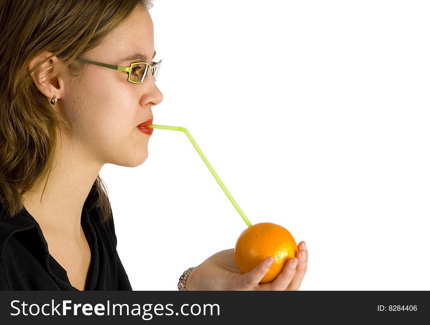 Nice girl drinking direct from the fruit