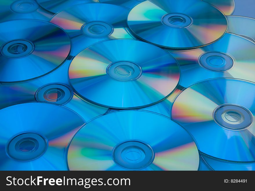 Lots of cd disks in blue light.