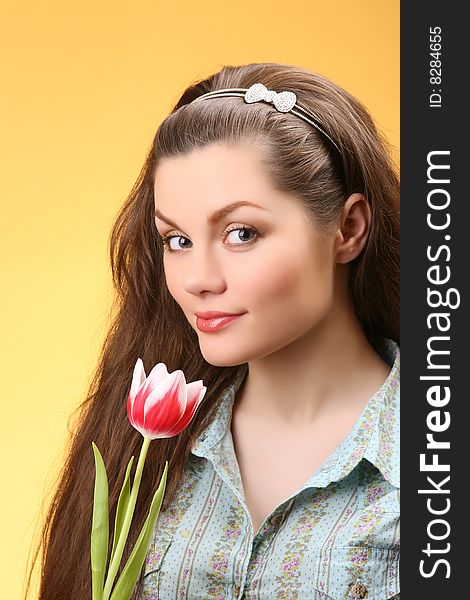 Closeup portrait of attractive woman with tulip. Closeup portrait of attractive woman with tulip