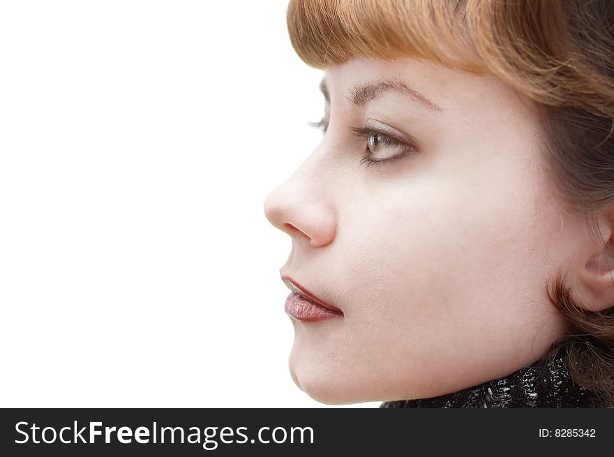 Portrait of young attractive woman in profile pose