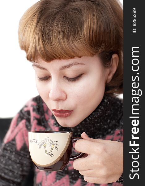 Young attractive woman drinking coffee