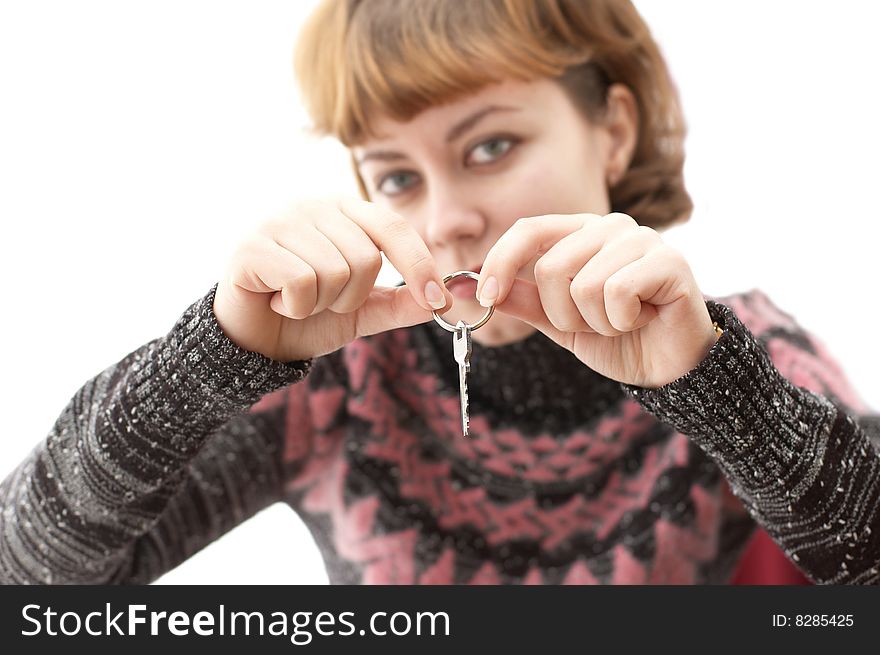 Young woman holding a key on white background. Young woman holding a key on white background