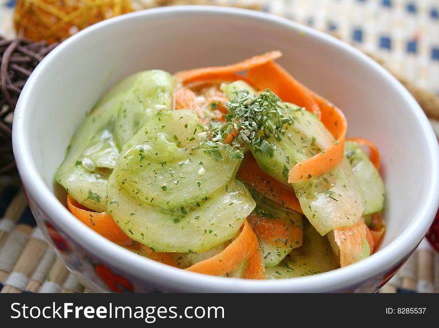 A fresh salad of cucumbers and carrots
