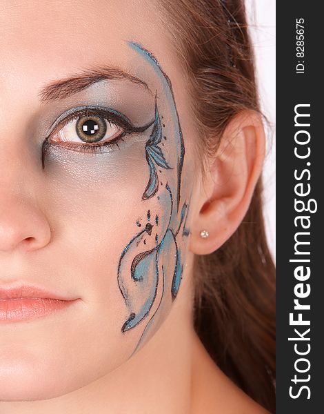 Brunette with blue makeup only halve face fantacy