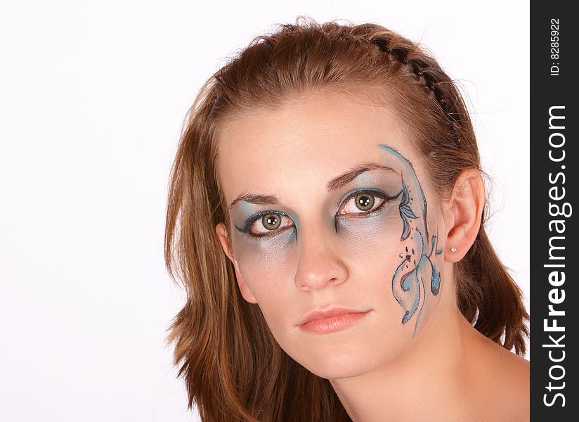 Blue makeup applied on thin brunette with serious look. Blue makeup applied on thin brunette with serious look
