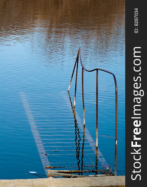 Rusty Staircase Going Nowhere In The Water