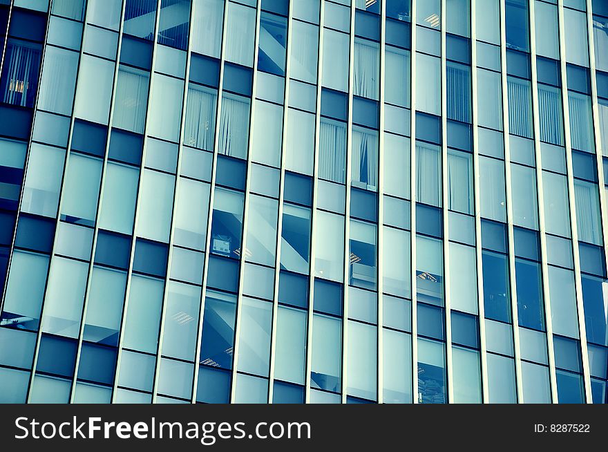 This photograph represent skyscraper windows. Perfect for use in corporate applications, communications, business events and more.