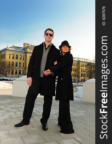 Young couple going to a walk in the town