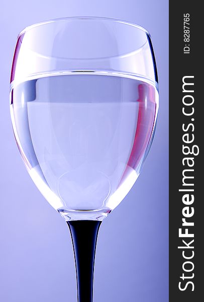 A footed tumbler with water