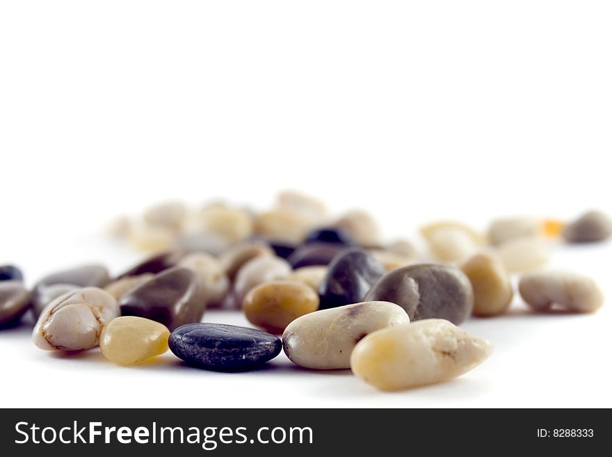 Pebble closeup on white background