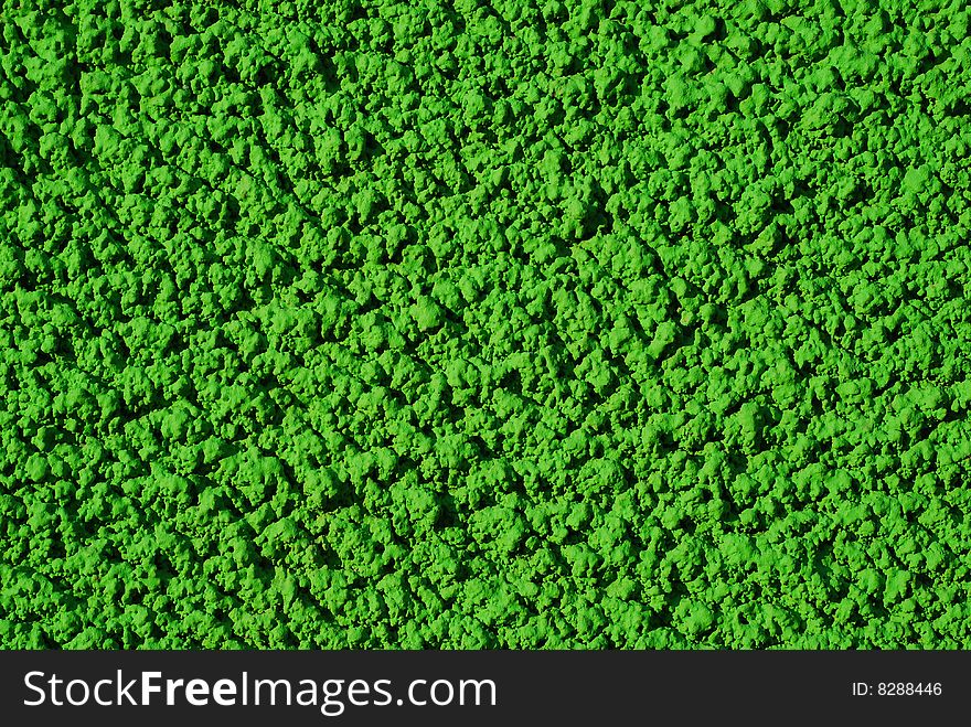 Green background texture. shote taken on the wall of a colored house. Green background texture. shote taken on the wall of a colored house