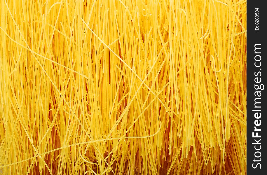 Homemade noodle as yellow abstract background. Homemade noodle as yellow abstract background