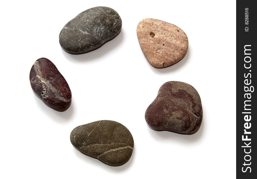 Close-up colored stones for spa procedures on a white. Close-up colored stones for spa procedures on a white.