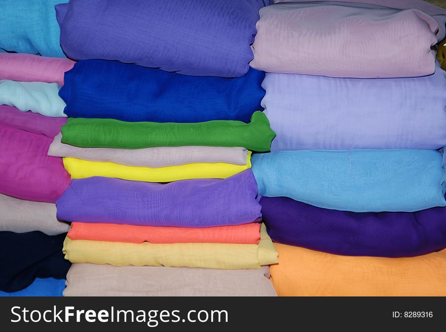 Stack of satin fabric of various colours. Stack of satin fabric of various colours