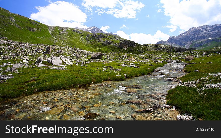 Quiet river in mountain by a sunny day. Quiet river in mountain by a sunny day