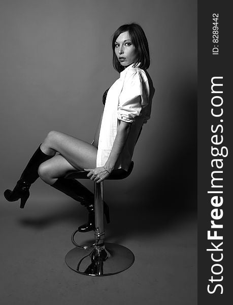 Sexy woman sitting on a chair