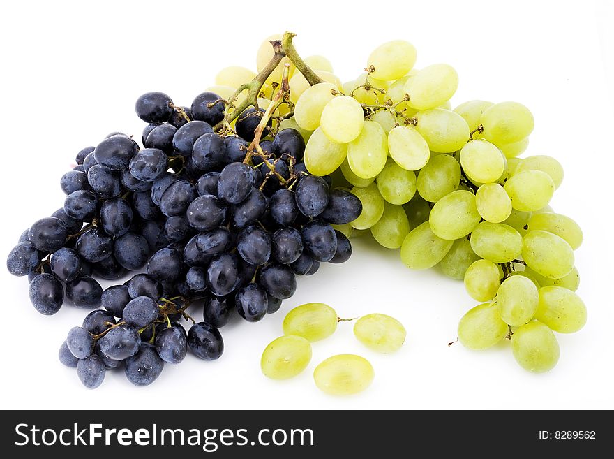 Two bunches of red and white grapes on white background