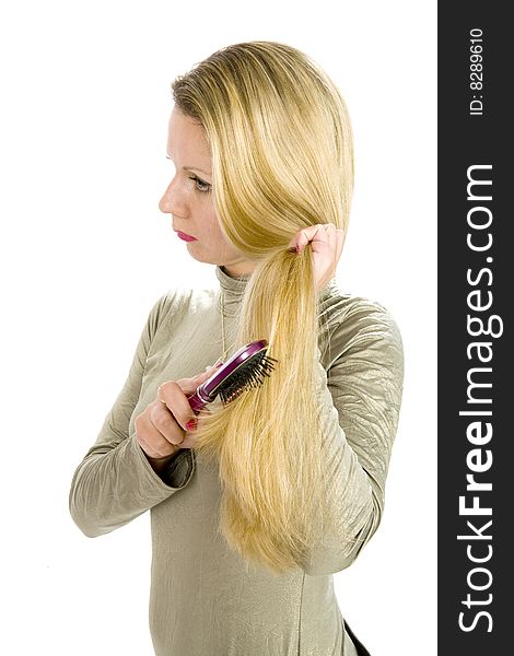 Long hair blonde woman with hairbrush in her hand. Long hair blonde woman with hairbrush in her hand