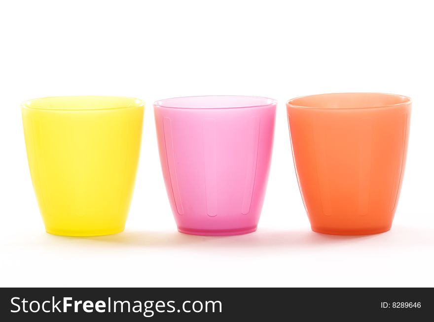 Plastic cups of various colors isolated on white