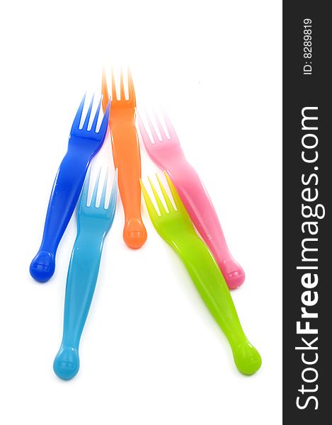 Colorful plastic forks on white. Colorful plastic forks on white