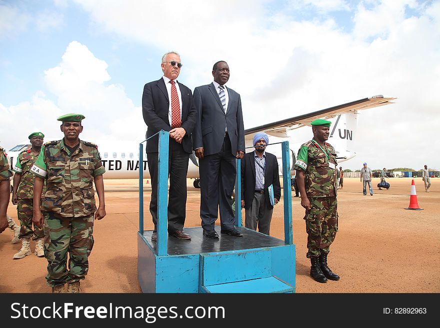 The Special Representative of the UN Secretary-General &#x28;SRSG&#x29; for Somalia, Michael Keating and the Special Representative of the African Union Commission Chairperson &#x28;SRCC&#x29; for Somalia, Ambassador Francisco Caetano Madeira receive a guard of honour from AMISOM troops on arrival at Kismaayo Airport, on November 24, 2016. UN Photo / Barut Mohamed. The Special Representative of the UN Secretary-General &#x28;SRSG&#x29; for Somalia, Michael Keating and the Special Representative of the African Union Commission Chairperson &#x28;SRCC&#x29; for Somalia, Ambassador Francisco Caetano Madeira receive a guard of honour from AMISOM troops on arrival at Kismaayo Airport, on November 24, 2016. UN Photo / Barut Mohamed