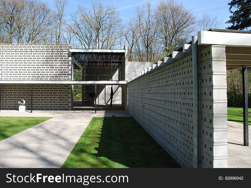 Modern home with brick walls and yard with cinder block fence. Modern home with brick walls and yard with cinder block fence.